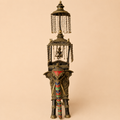 Ornate brass elephant sculpture with canopy