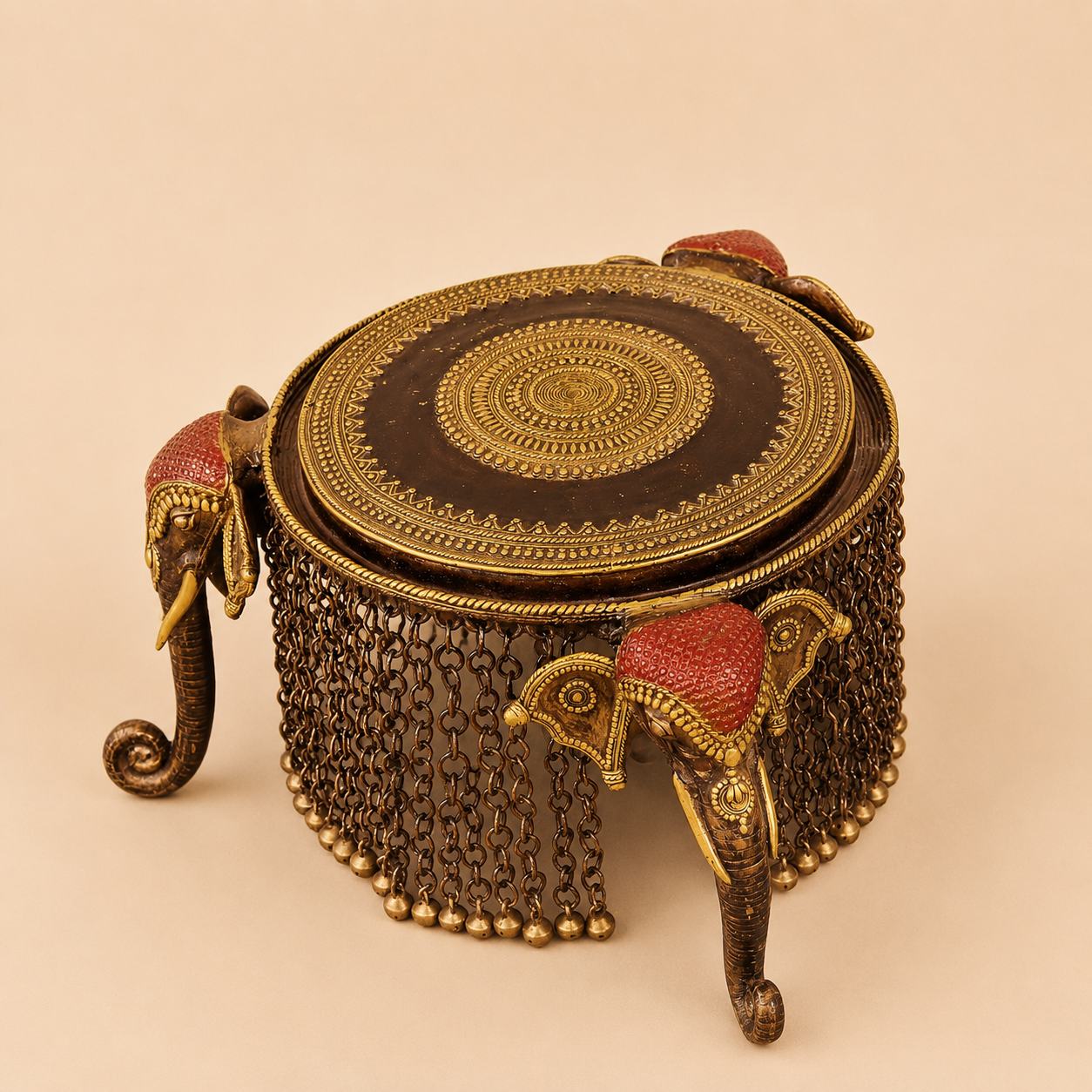 Ornate brass elephant stool with chain fringe