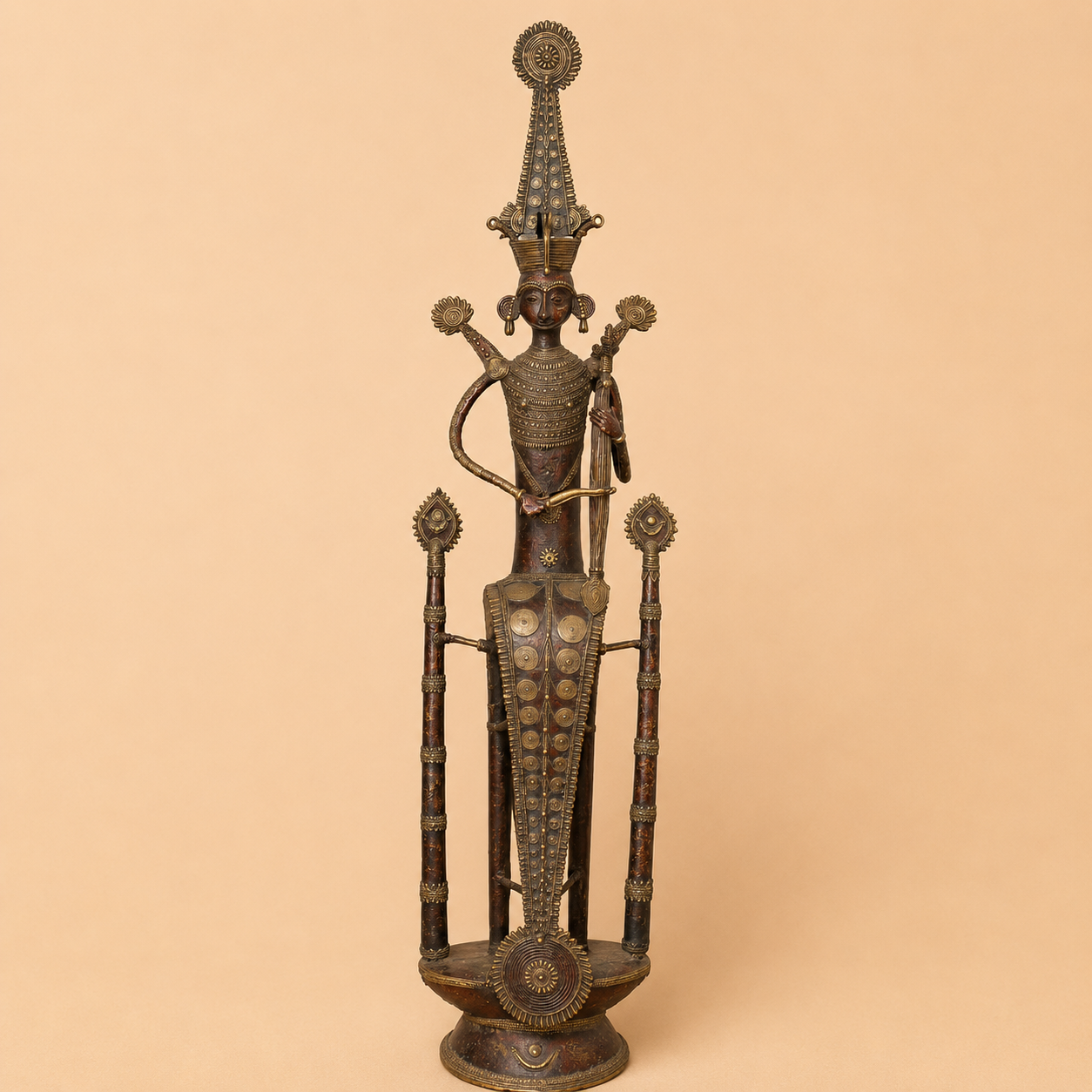Ornate tribal ceremonial metal statue