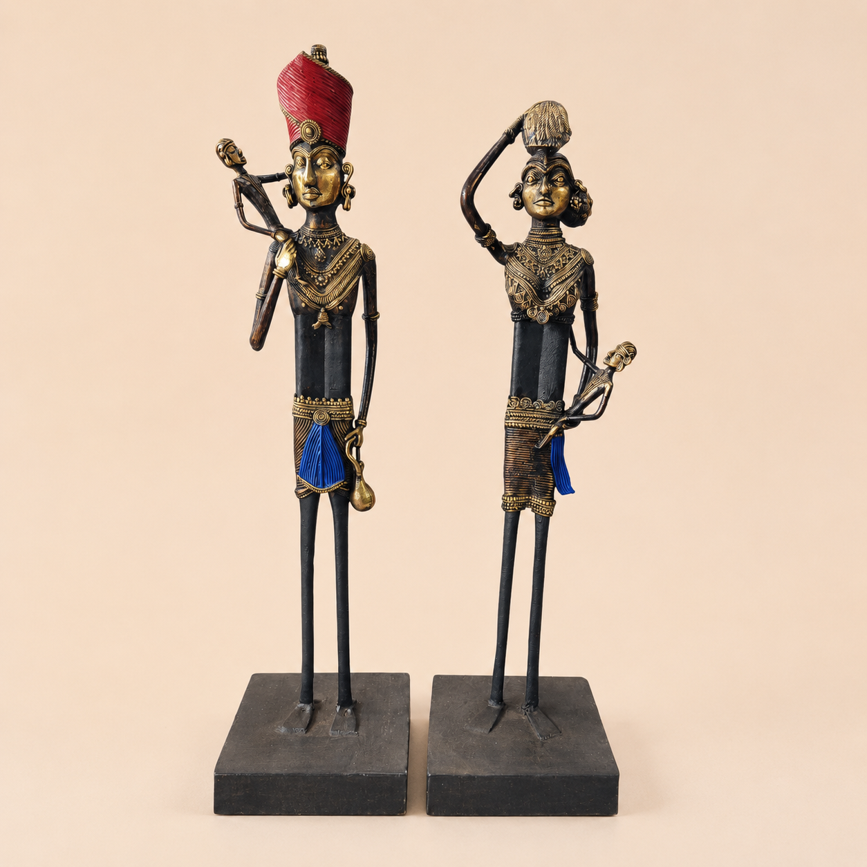 Ornate tribal metal figurines on display