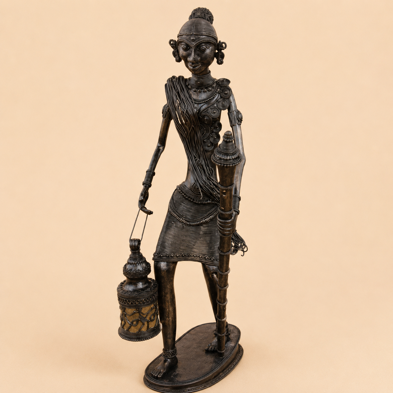 Tribal bronze figurine on neutral backdrop